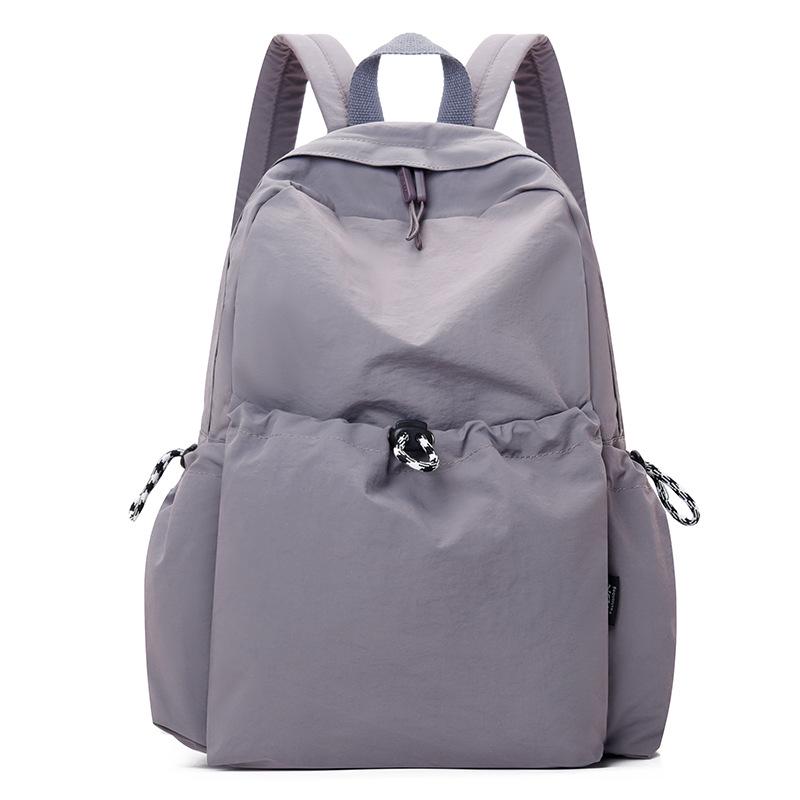 

Корейский женский нейлоновый рюкзак весна-лето 2025: Модный однотонный повседневный школьный ранец для студентов фиолетовый
