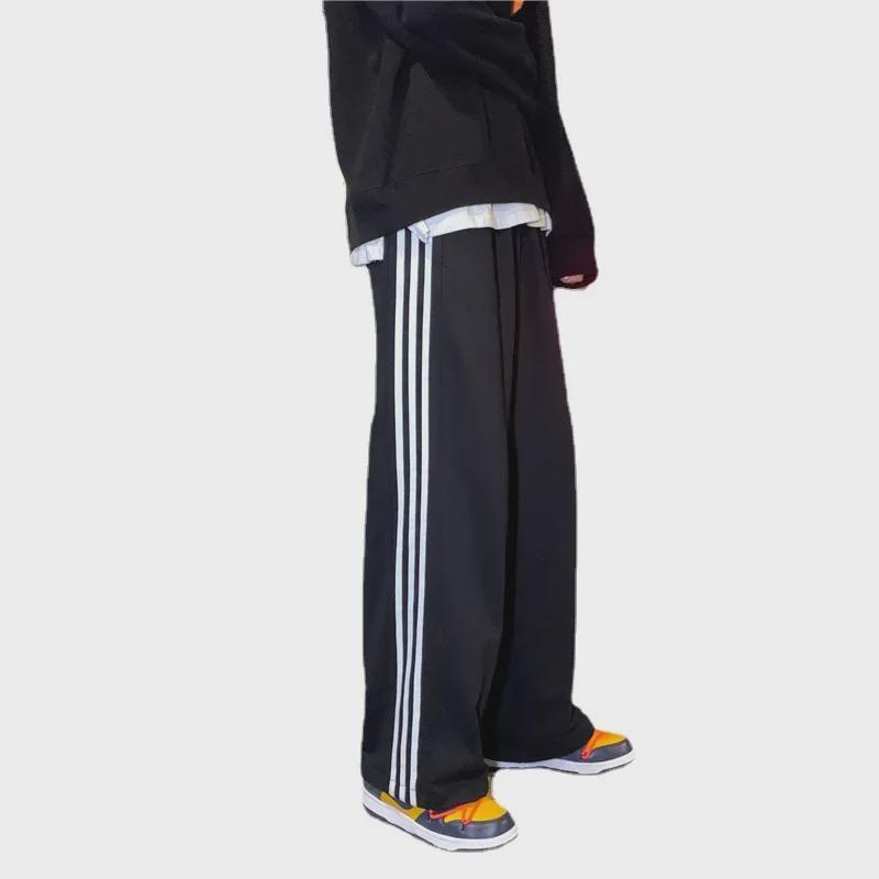 Damskie spodnie sportowe w paski w stylu koreańskim - luźne, sięgające do ziemi, w jednolitym kolorze, na wiosnę i jesień