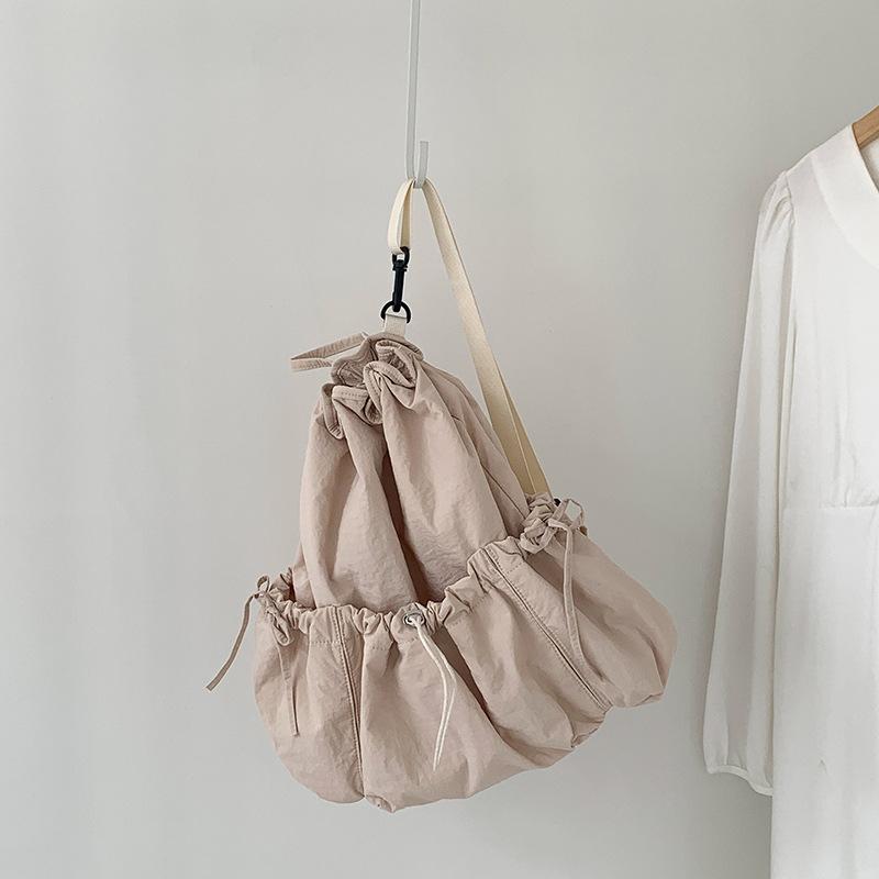 

Summer New Korean Casual Drawstring Backpack with Double Shoulder Foreskin for Women, Large Capacity, Personalized, Simple, College Nylon Backpack абрикосовий