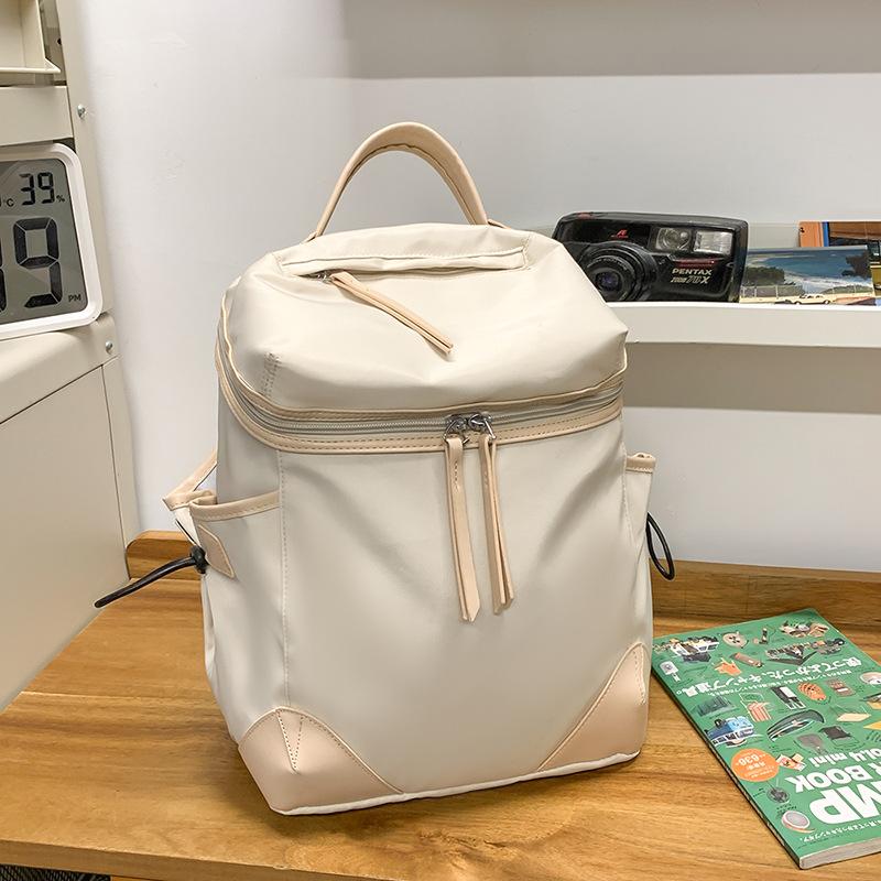 Neuer lässiger vielseitiger Rucksack mit großer Kapazität, leichter und modischer Pendler-Reiserucksack, Nischen-Einfarb-Schulranzen
