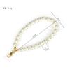Manufacturer spot supply clothing versatile pearl chain car trailer mobile phone case short URL fashion pendant accessories hairball chain