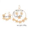 Retro Metal Hollow Flower Jewelry Set: Necklace, Bracelet, Earrings & Ring for Elegant Women