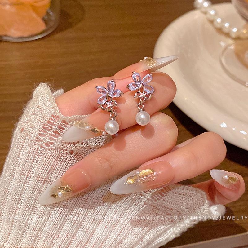 Silver needle zircon flower pearl earrings women s design temperament butterfly stud earrings light luxury fashion personalized earrings