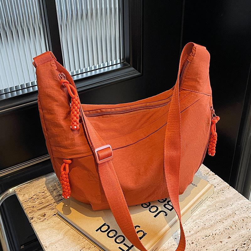 Trendy new products ins simple fashion lightweight sports style dumpling bag leisure travel versatile solid color messenger bag women