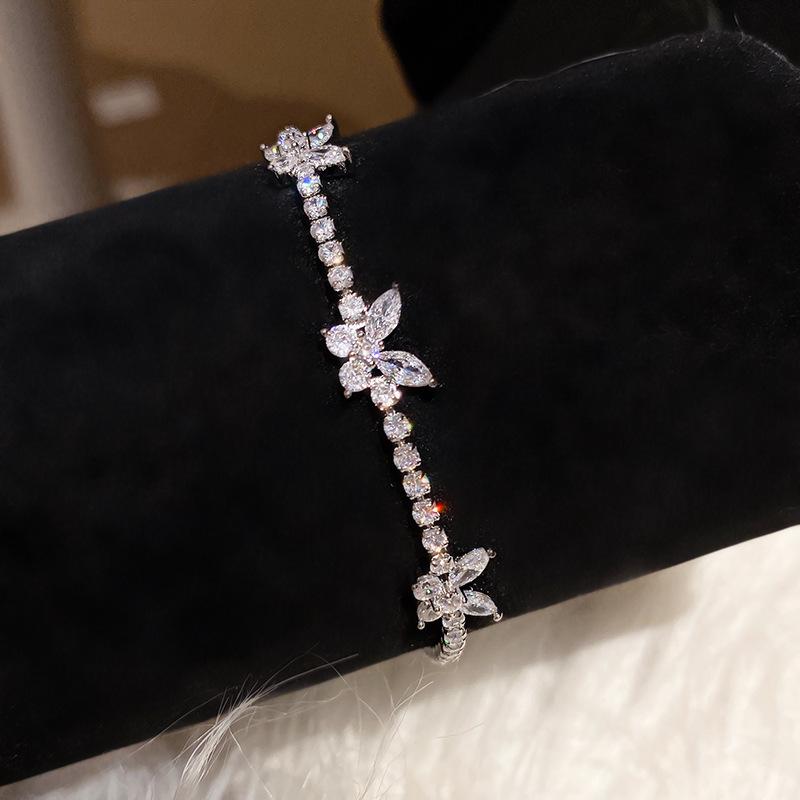 Pink Diamond Zirconia Starburst Flower Bracelet: Trendy, Luxurious Jewelry with Unique Design.