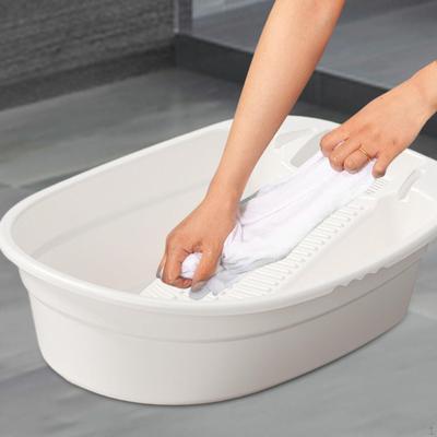 Compact Laundry Basin with Built-In Scrubbing Surface