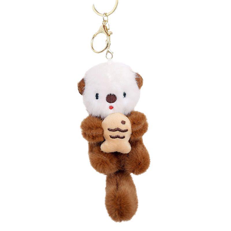 Cartoon Sea Otter Plush Keychain: Cute Fish-Hugging Sea Dog Pendant for Backpacks & More