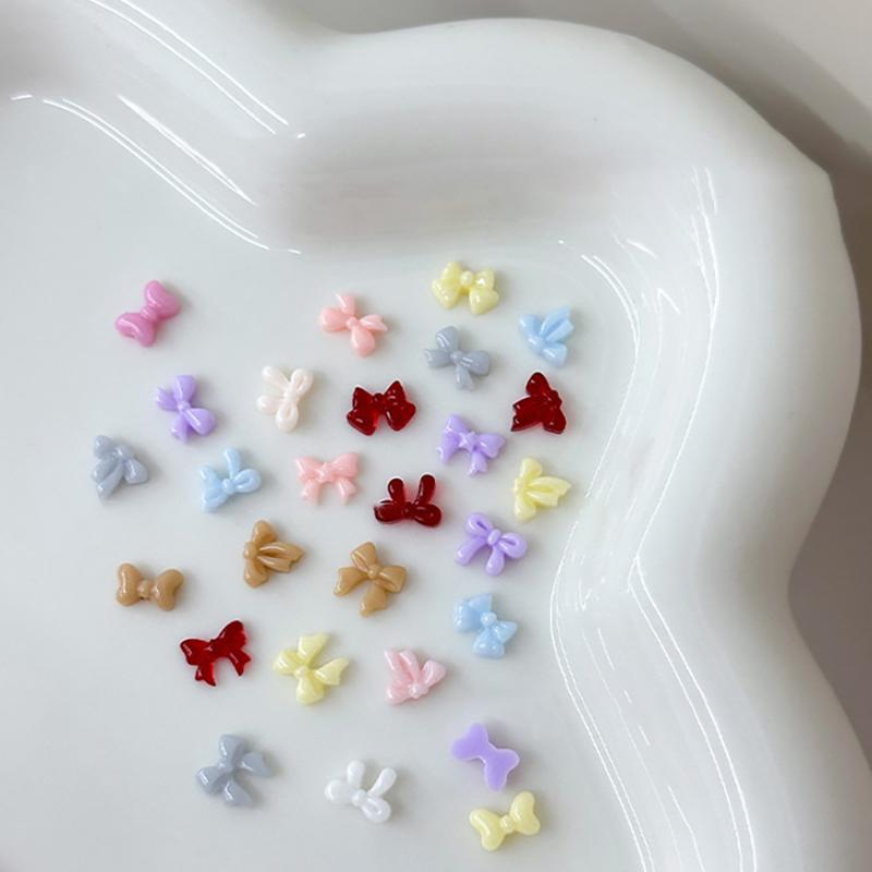 100Pcs 3D Mini Bow Resin Nail Art Decoration Bowknot Ornament Nail Charm Jewelry Design Kawaii Gem