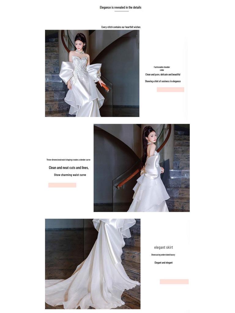 Elegantní saténové svatební šaty bez ramínek, střihu rybího ocasu, s vlečkou pro nevěstinu recepci nebo zásnubní hostinu.