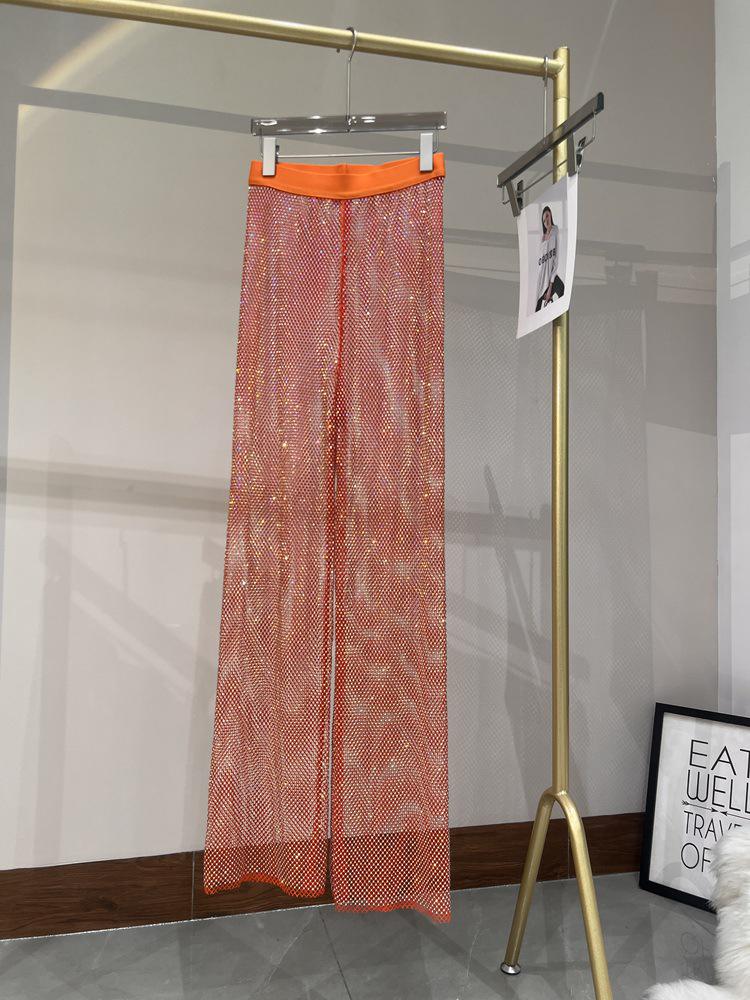 Letní sexy síťované kalhoty s výřezy a kamínky se širokými nohavicemi do nočního klubu