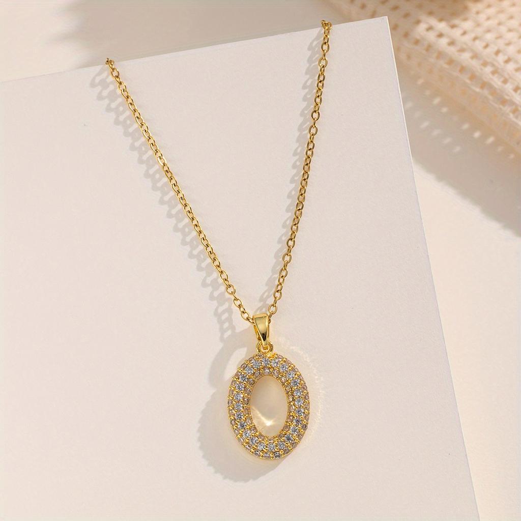A gold-plated stainless steel chain necklace with cubic zirconia in an oval shape, featuring a creative and unique design, offering a light luxury,