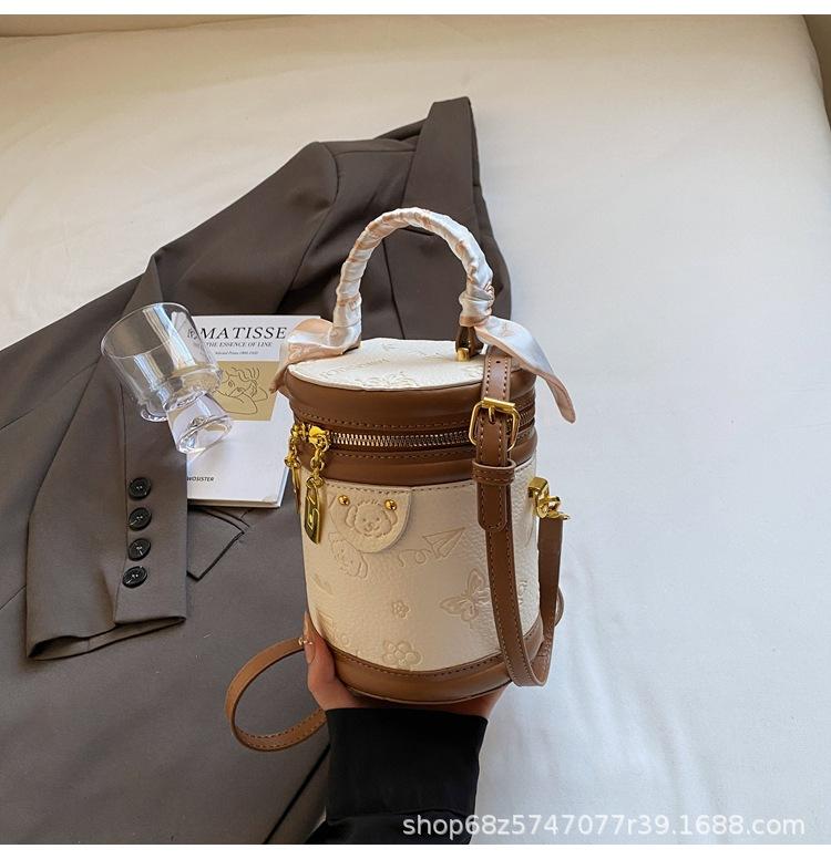 Hot-selling versatile high-end Korean version temperament portable bucket bag niche cute embossed women's messenger bag