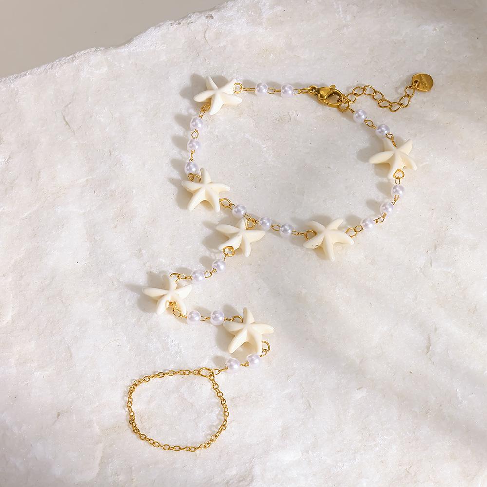 European and American stainless steel back chain starfish vacation wind plated 18K gold imitation pearl jewelry waterproof finger bracelet