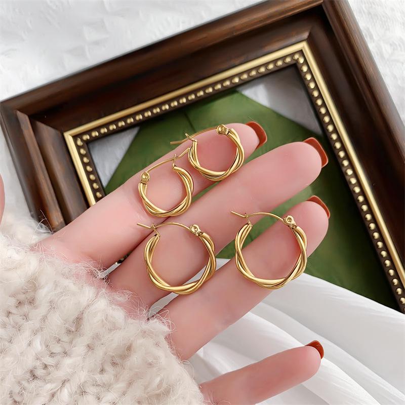 French Retro Gold-Plated Twisted Hoop Earrings - Titanium Steel Studs for Women, European-American Fashion.