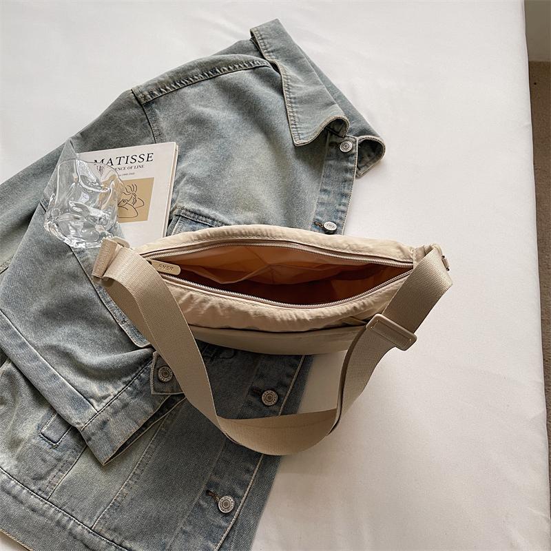 Minimalist Crossbody Bag with Adjustable Strap and Front Zip Pocket Lightweight Everyday Shoulder Bag
