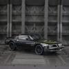 1:32 simulierte Pontiac Firebird Legierungsauto-Modelle Türen auf beiden Seiten, die geöffnet werden können, hat Ton- und Lichtfunktionen