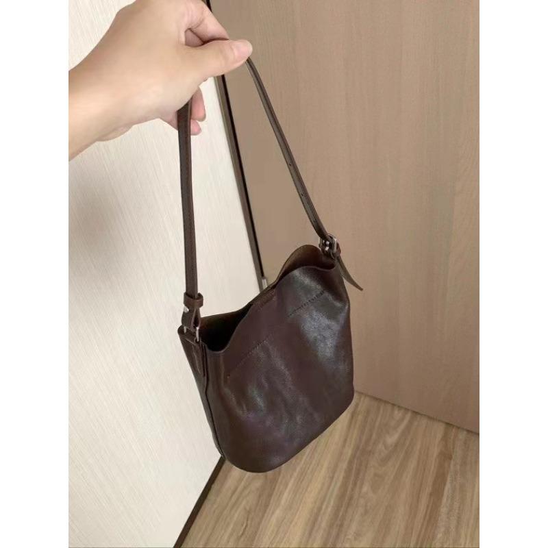 

Vegetable-tanned top layer cowhide underarm bag women s retro versatile one-shoulder large-capacity commuter bag commuter handbag bucket bag 15*9*17cm коричневий