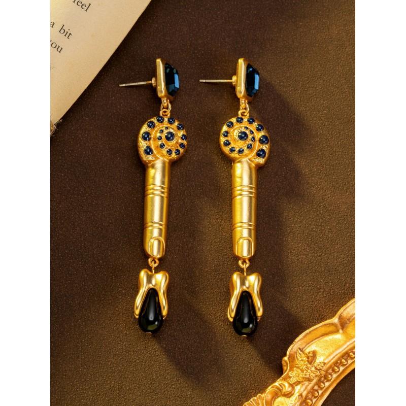 Vintage Long Finger Tooth Earrings With A Retro Court Style Surrealistic Design Featuring
