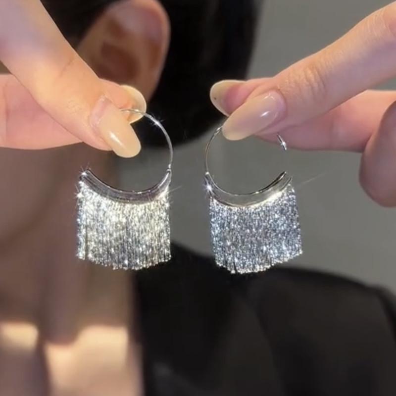Silver Needle Sequin Tassel Earrings: Chic Cold Style, High-End Design, Fashionable Dangle for a Sophisticated Look.