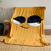 Minimalist cartoon face with large expressive eyes and a sly smile. for all seasons blanket lunch break throw gift
