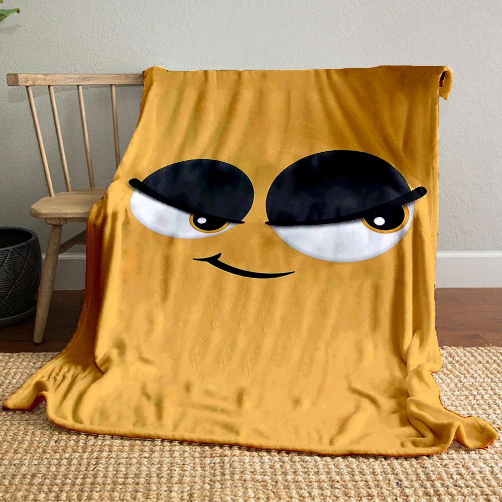 Minimalist cartoon face with large expressive eyes and a sly smile. for all seasons blanket lunch break throw gift