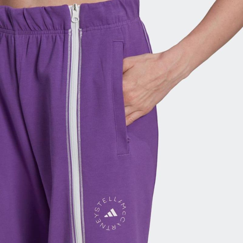 adidas Spodnie sportowe damskie z nadrukowanym logo, z bocznym zamkiem błyskawicznym, dopasowane, z prostą nogawką, fioletowe HT0087