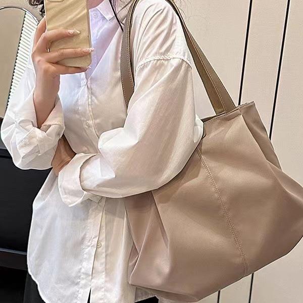 Women's new one-shoulder handbag, separated tote bag, large-capacity hand-carried canvas bag.