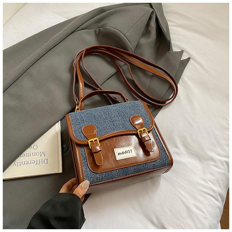 

Niche college style backpack women s 2025 new versatile contrasting color travel shoulder bag texture commuter travel bag