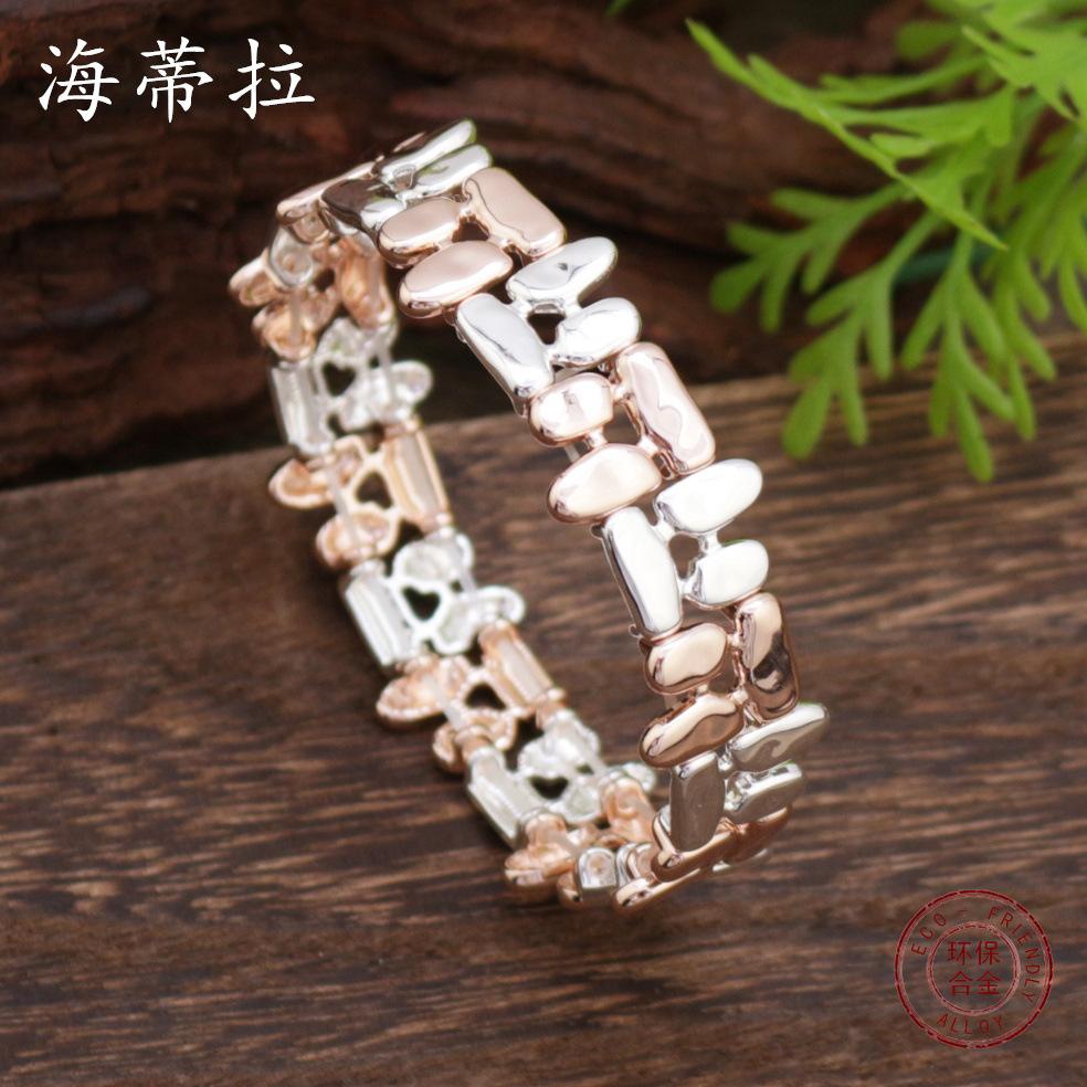 Hohles geometrisches Linien-Elastikarmband, personalisiertes vielseitiges zweifarbiges Zinklegierungsarmband für Damen und Herren