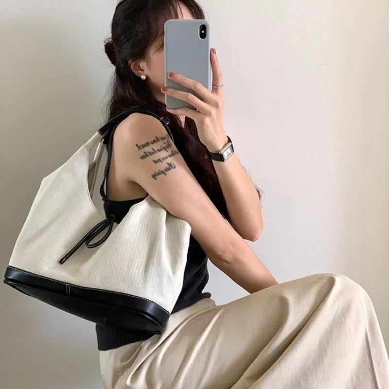 Niche bow denim canvas splicing single shoulder underarm tote bag lazy wind casual large capacity bag women
