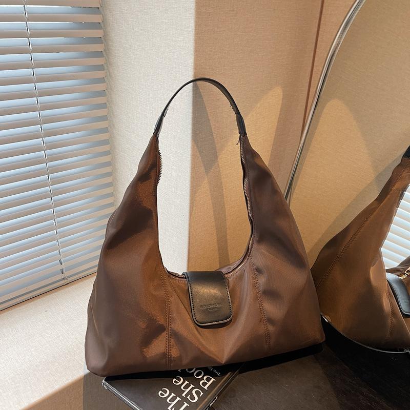 

Niche high-end underarm bag women s handbag 2025 new nylon dumpling bag versatile shoulder bag кавовий