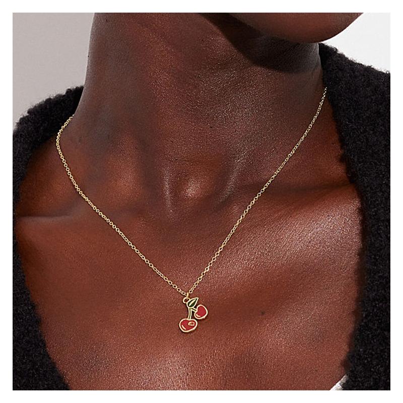 COACH Cherry Pattern Girl Pendant Copper Necklace Women's Gold