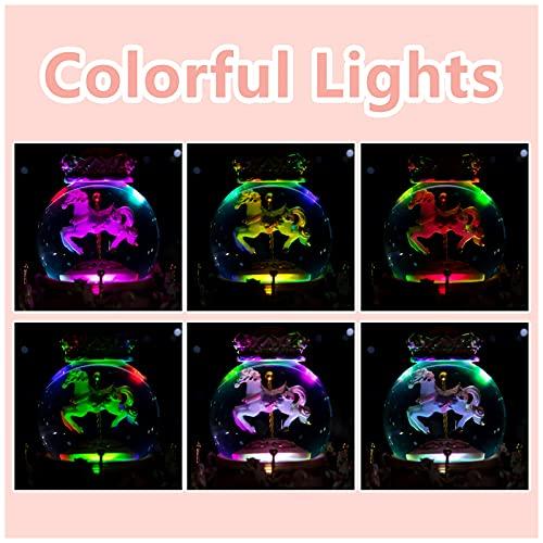 Snow globe with music box, color LED lights, merry-go-round, and crystal balls for automatic snowfall. A popular birthday or Christmas gift for girls,