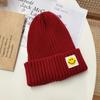 Smiley face label wool hat female autumn and winter warm bag head couple trendy brand cold hat solid color student male knitted hat
