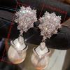 Fashion flower zircon dangle earrings with faux pearl pendant. Luxury bridal style for wedding and banquet occasions.