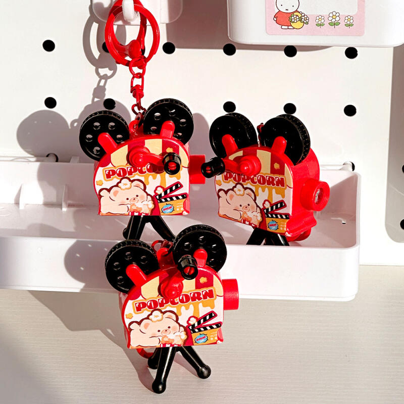 1 box of popcorn projector keyrings (6 pieces) 6-piece popcorn projector keyring set