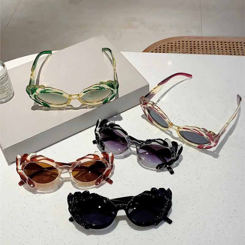 Neue Katzenaugen-Sonnenbrille mit kleinem Rahmen, vielseitig, avantgardistisch, UV-beständig, unregelmäßige Dekorbrille