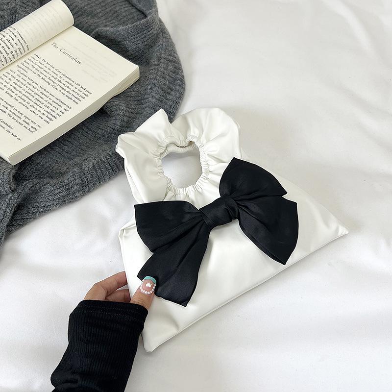 

Bow hand carry small bag women s 2024 spring and summer new beautiful girl fashion simple portable bucket bag білий