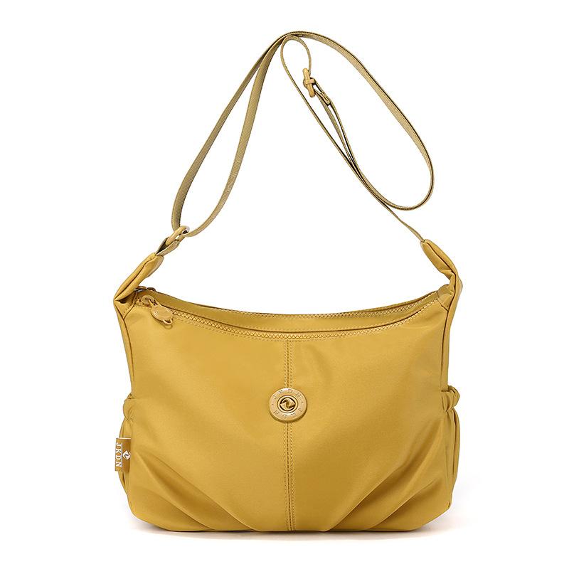 Elegant Slouch Shoulder Bag with Top Zip Closure Adjustable Strap Geometric Stitching and Smooth Nylon Fabric for Modern Daily Wear and Commuting