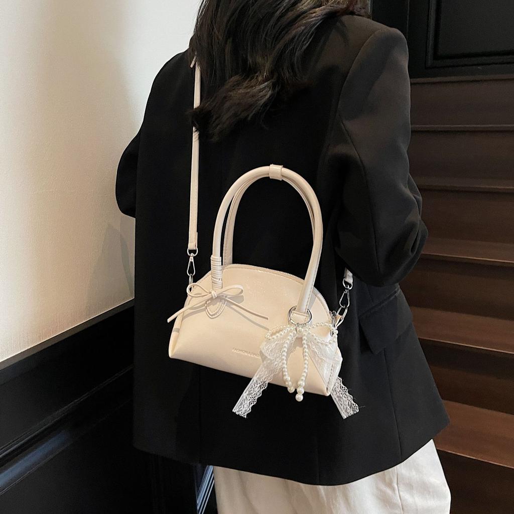 New Sweet Bow Commuter Shell Bag Women's 2025 Korean Version Simple Popular Shoulder Bag Foreign Style Armpit Bag