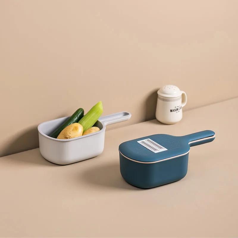 Forniture da cucina Tagliaverdure multifunzione Grattugia per artefatti Patatine fritte Tritatutto domestico Cestello di scarico Macchina affettatrice per pomodori e carote Tritatutto