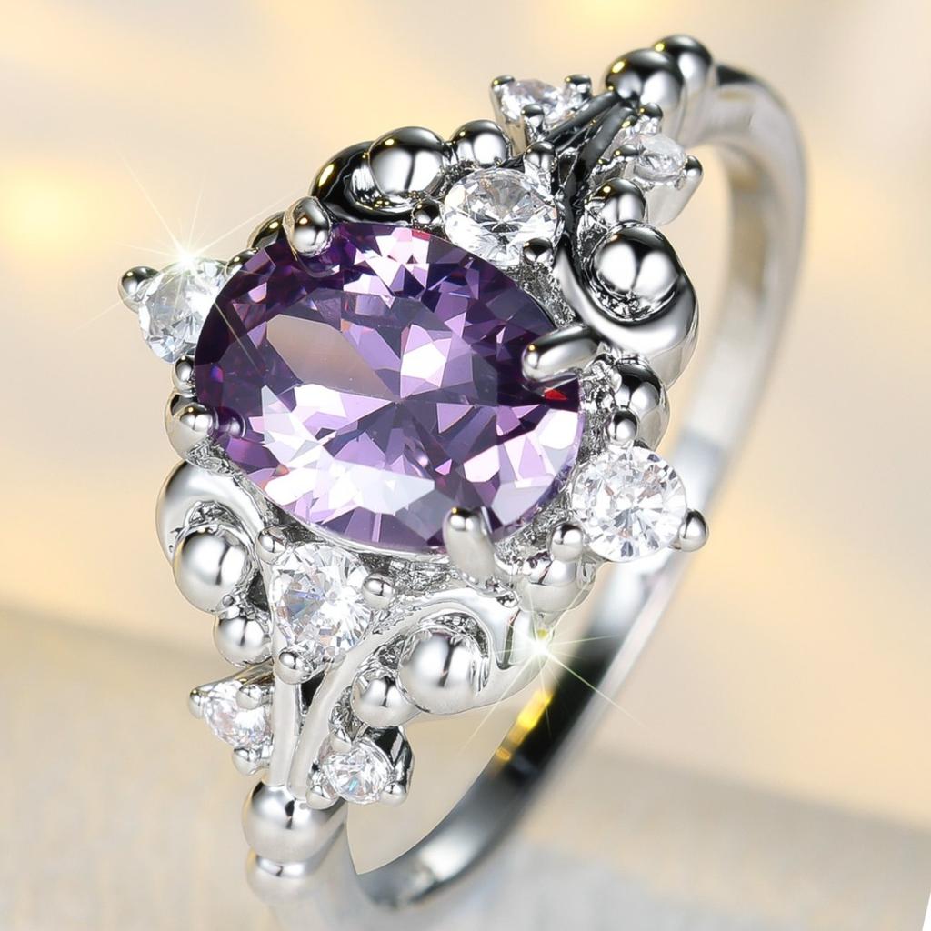 Elegant formal occasion halo ring with a curved metal frame and dazzling inlay details, a high-end accessory for women's engagement ceremonies and