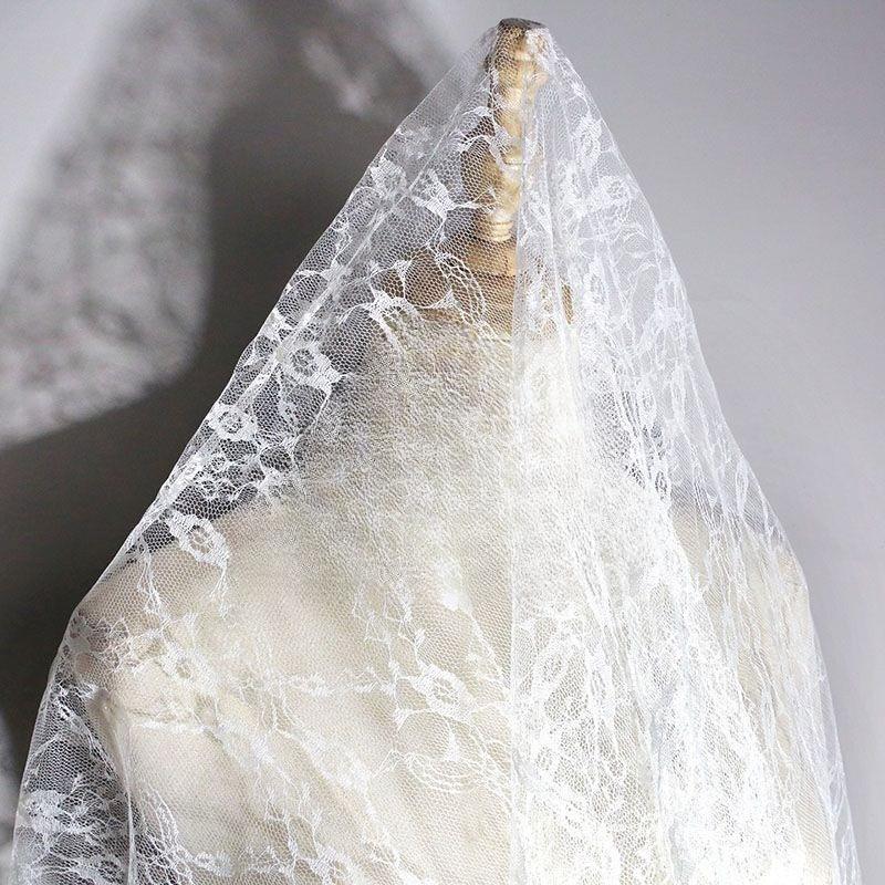 Embroidered lace fabric with hollowed-out patterns can be used for wedding dresses evening gowns and designer clothing fabrics