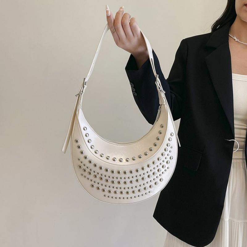 Designerska torba na ramię z ćwiekami, nitowana torebka półksiężycowa, lato 2025 nowa damska metalowa torebka pod pachę, retro nitowana torebka na ramię w kropki
