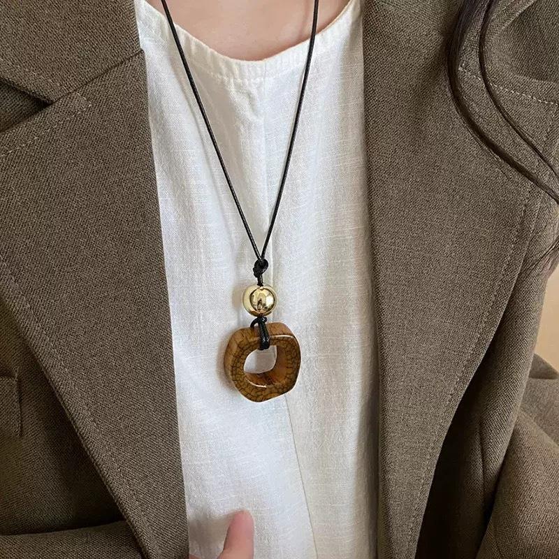 2025 New Chinese Style Unique Resin Pendant Necklace - Retro Niche Long Sweater Chain for Women