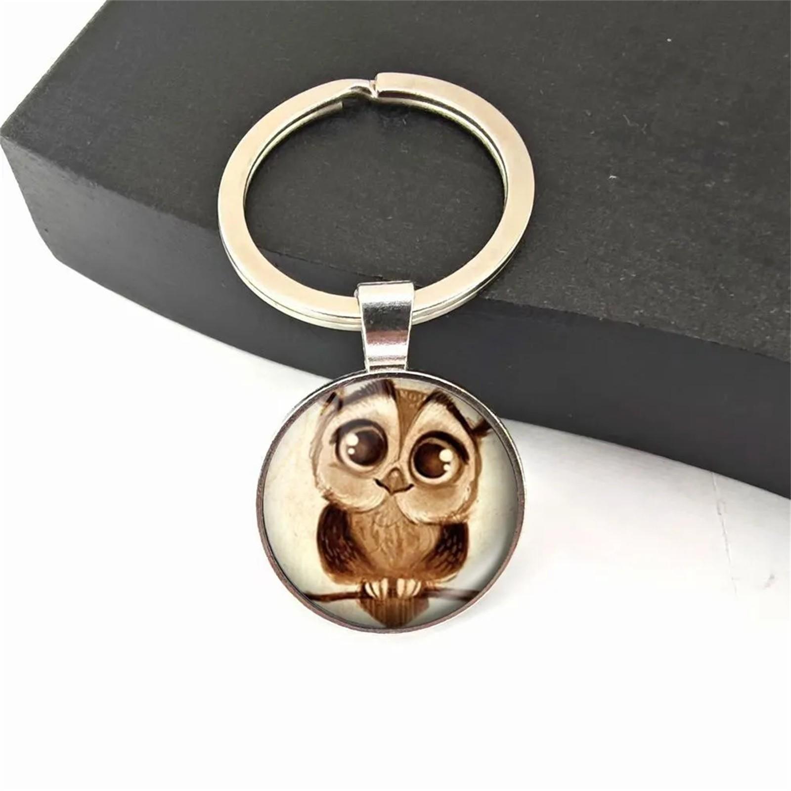 

Брелок для ключей с рисунком в виде сумки серебряный