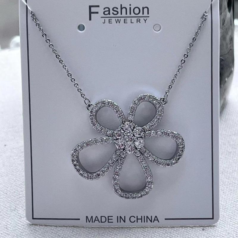 Korean Version Of Temperament Hollow Flower Earrings Personalized Full Diamond Stud Earrings Women'S Silver Needle Copper High-End Earrings