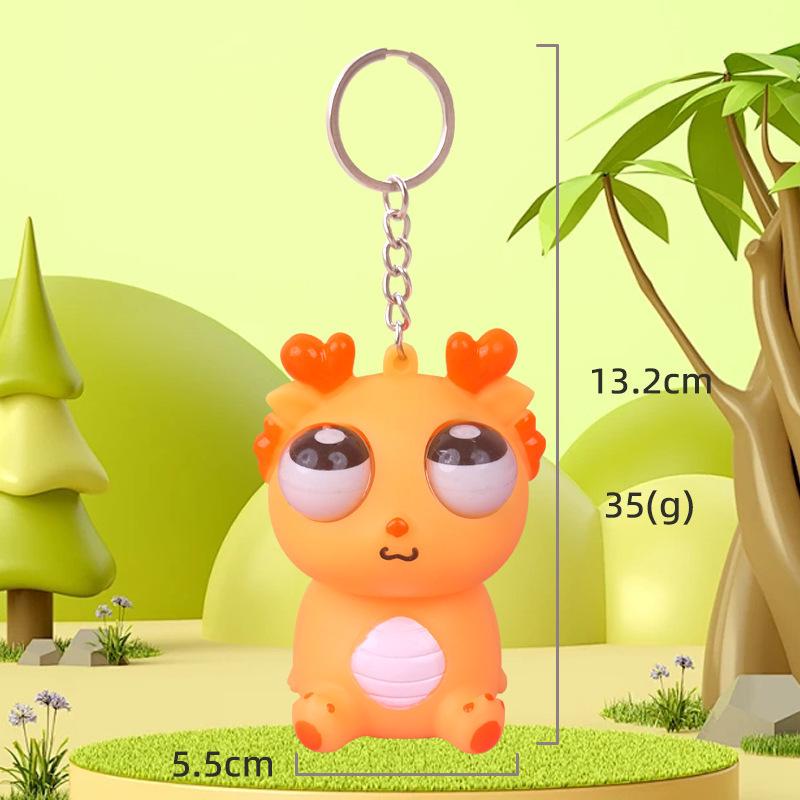Exploding Eye Dragon Keychain: Squishy Stress Relief Toy and Pendant