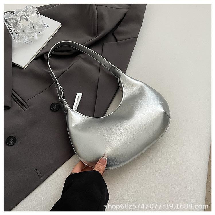 Small bag trend 2025 new fashion handbag high sense versatile women's bag single shoulder solid color half moon armpit bag
