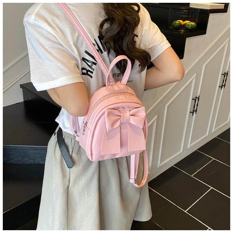 Sac à dos en cuir synthétique style coréen avec nœud papillon pour femme Sac à bandoulière matelassé léger